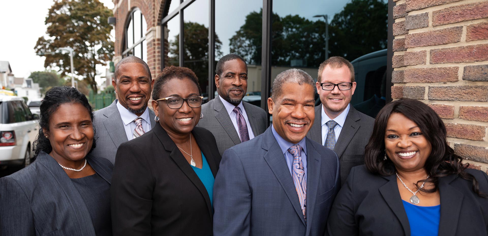 United Housing Management is now UHM Properties. Image of seven person executive team